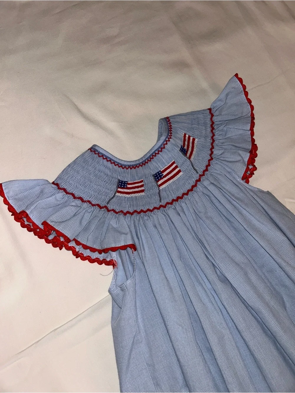 Girls' Light Blue Smocked Dress with Red Trim and Flag Embroidery